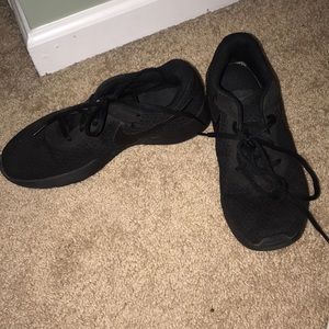 All black Nike sneakers